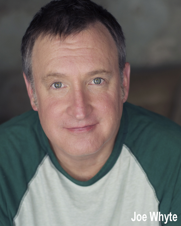Joe Whyte headshot, wearing a green and white shirt